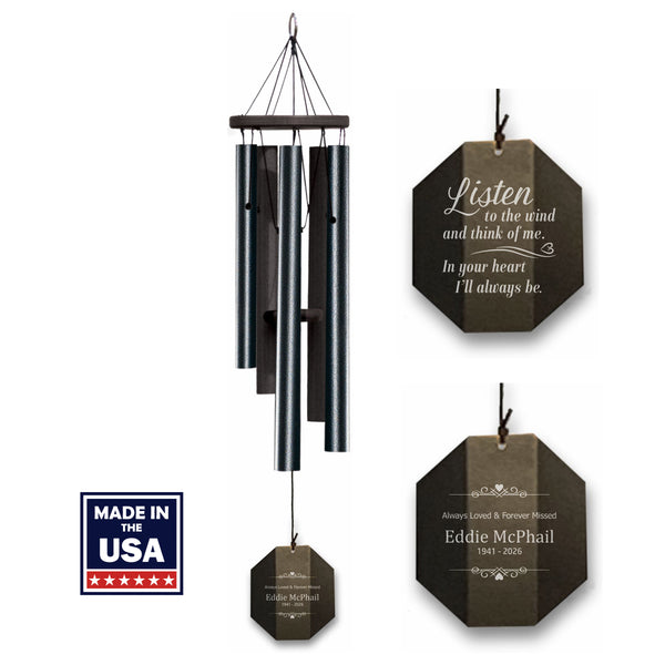 Black wind chime with engraved memorial text and 'Made in USA' label on a white background