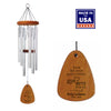 A silver wind chime with a wood top and wind sail, featuring inscriptions. The chime is displayed alongside an award badge stating 'Made in USA'.