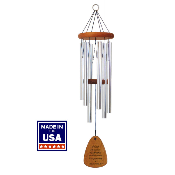 Wind chime with wooden wind sail and 'Made in the USA' label on a white background. Features silver tubes and engraved retirement saying.